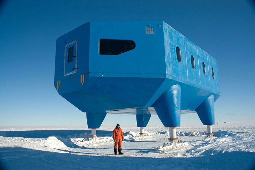 Halley VI Project Manager Karl Tuplin stands besides the completed module. - © British Antarctic Survey