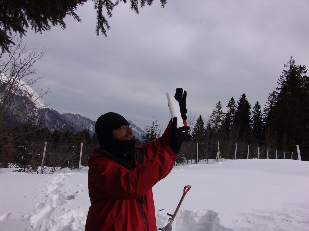 Charlie Zender using an instrument to measure snow albedo in the Alps - © Charlie Zender