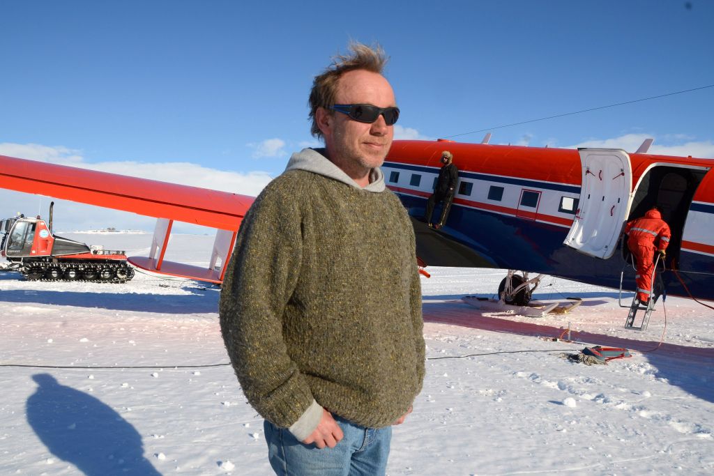 Christian Müller poses in front of AWI's Polar 6 aircraft after flying a mission. - © International Polar Foundation / Jos Van Hemelrijck