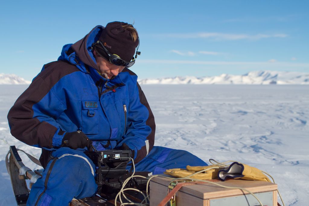 2012 laureate Reinhard Drews working with a radar device he used to image the Roi Baudoin Ice Shelf. - © Lionel Favier