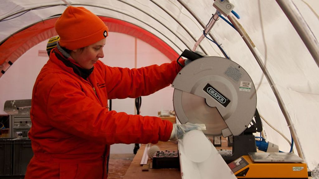 Dr. Nerilie Abrams cutting a piece of the James Ross Island ice core