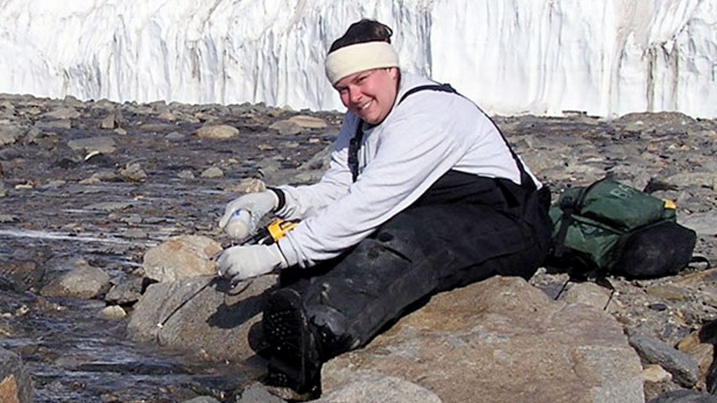 Jenny Baeseman sampling Green Creek in the McMurdo Dry Valleys